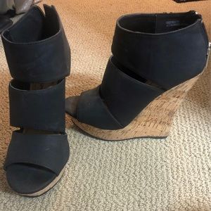 Black wedged heels. Worn but in good condition